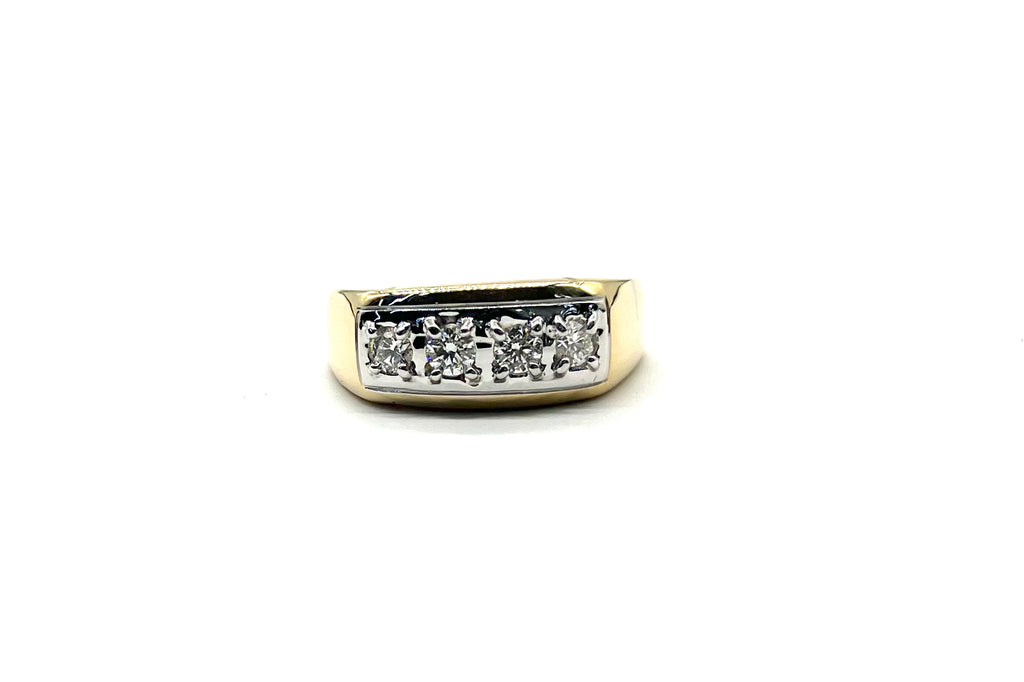 Gold ring with embedded diamonds on a white background