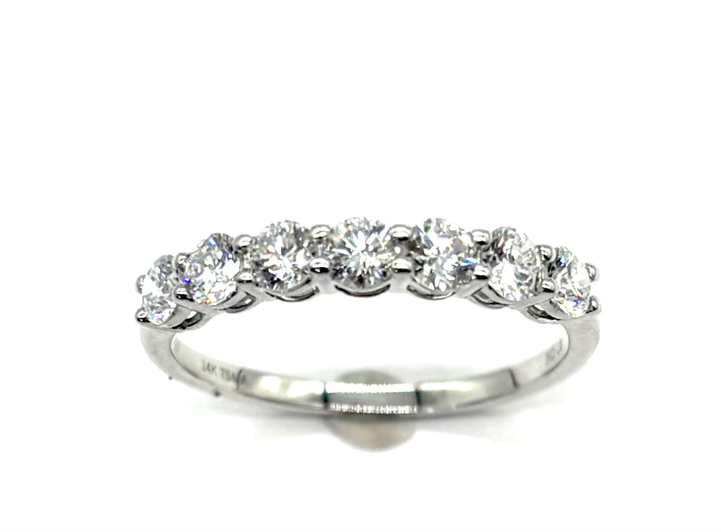 Diamond ring with five stones on a white background