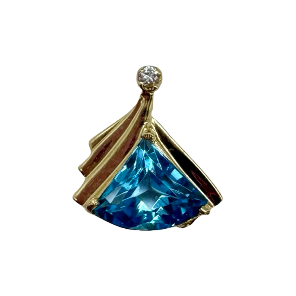 Jewelry pendant with blue gemstone and gold accents on a white background