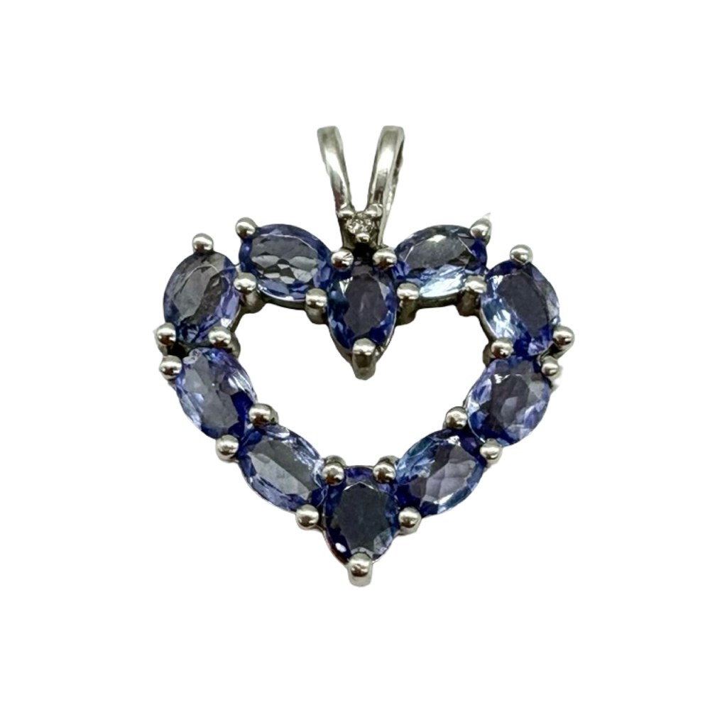 Heart-shaped sapphire pendant on a white background