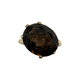 Gold ring with a large brown gemstone on a white background