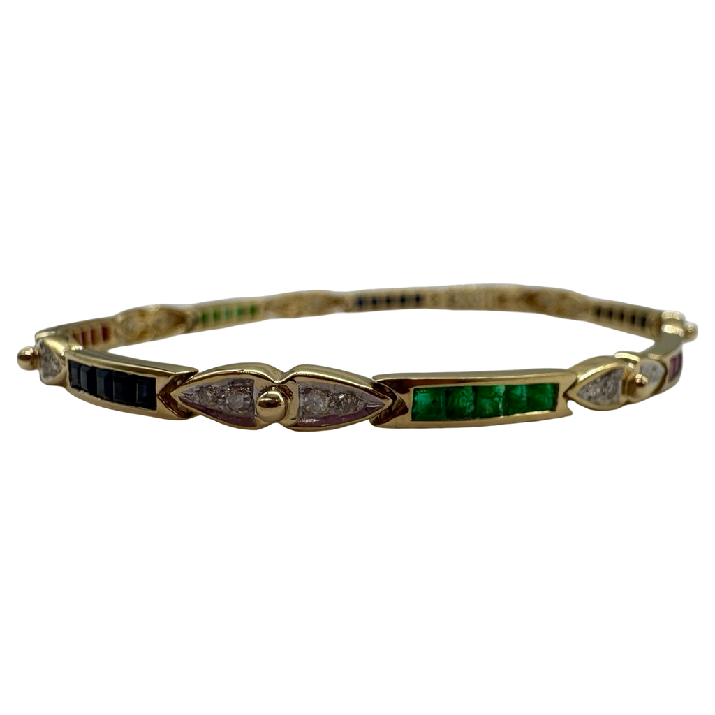 Gold bracelet with green gemstones and diamonds on a white background