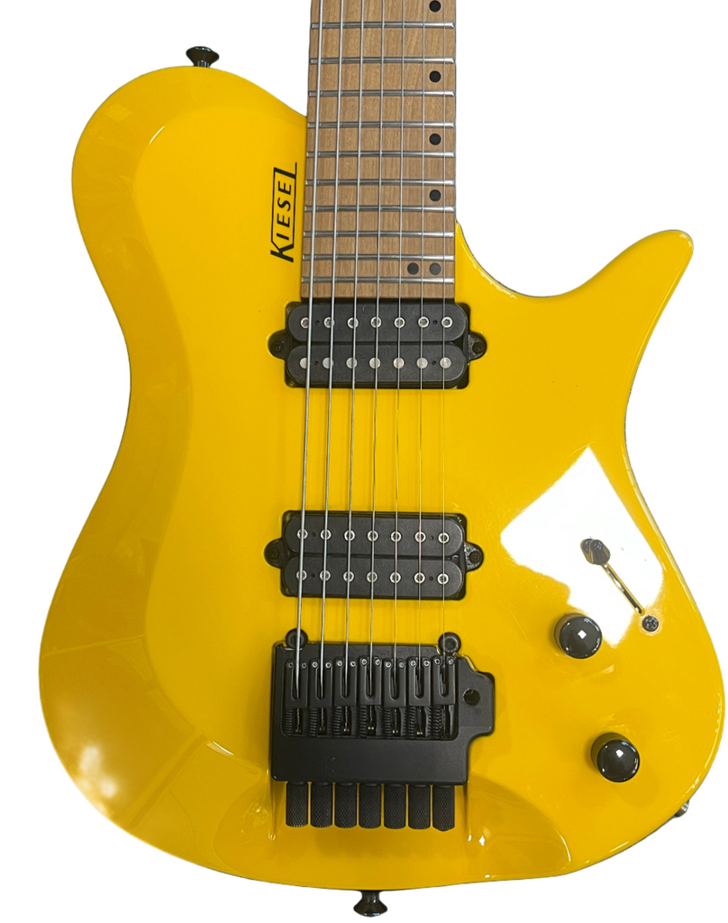 Yellow electric guitar with 'Kiesel' branding on a blue background