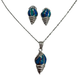 .925 Sterling Silver Blue Opal Seashell Necklace and Earring Set Silver conch shell necklace and earrings on a white background