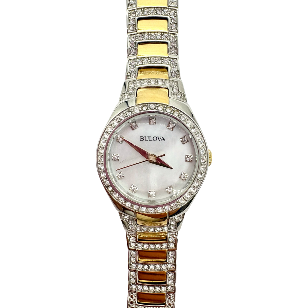 Bulova watch with two-tone gold and silver band on a white background