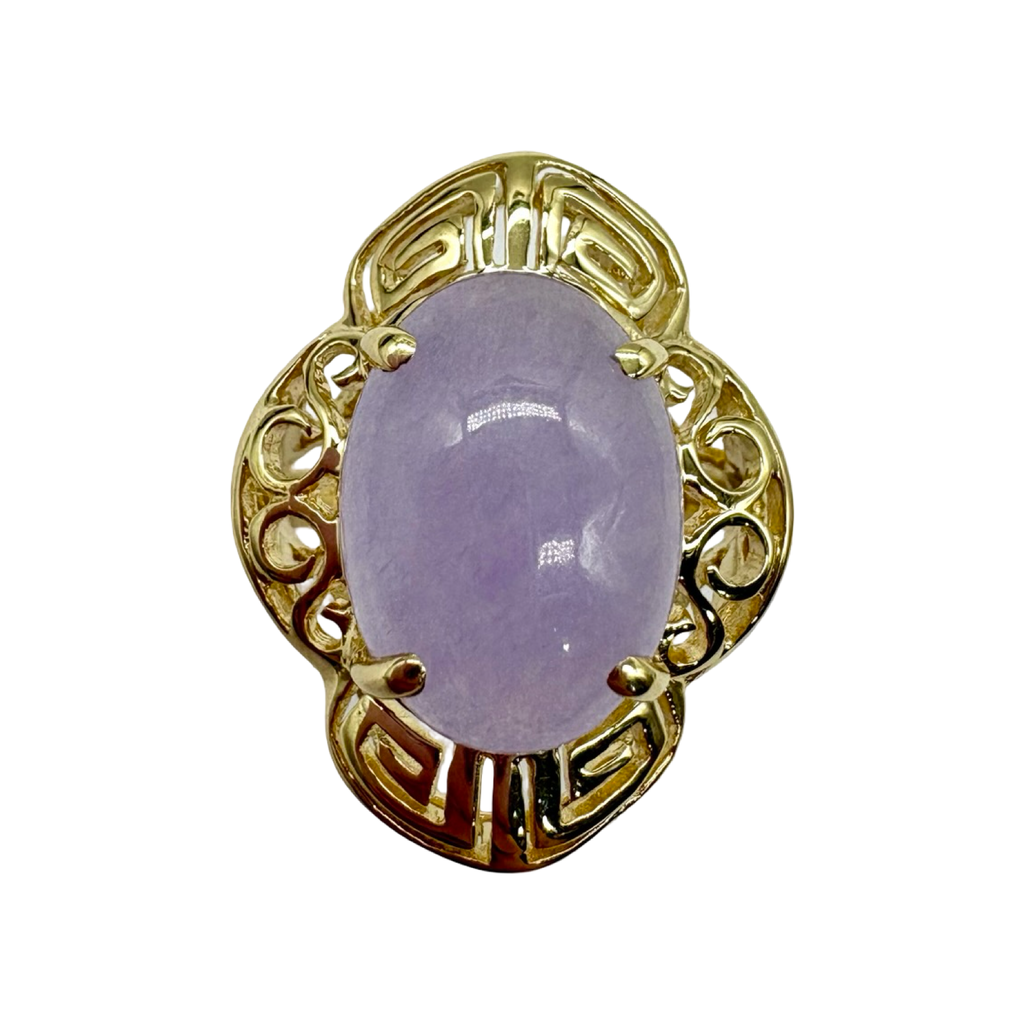 Gold ring with a purple gemstone on a white background