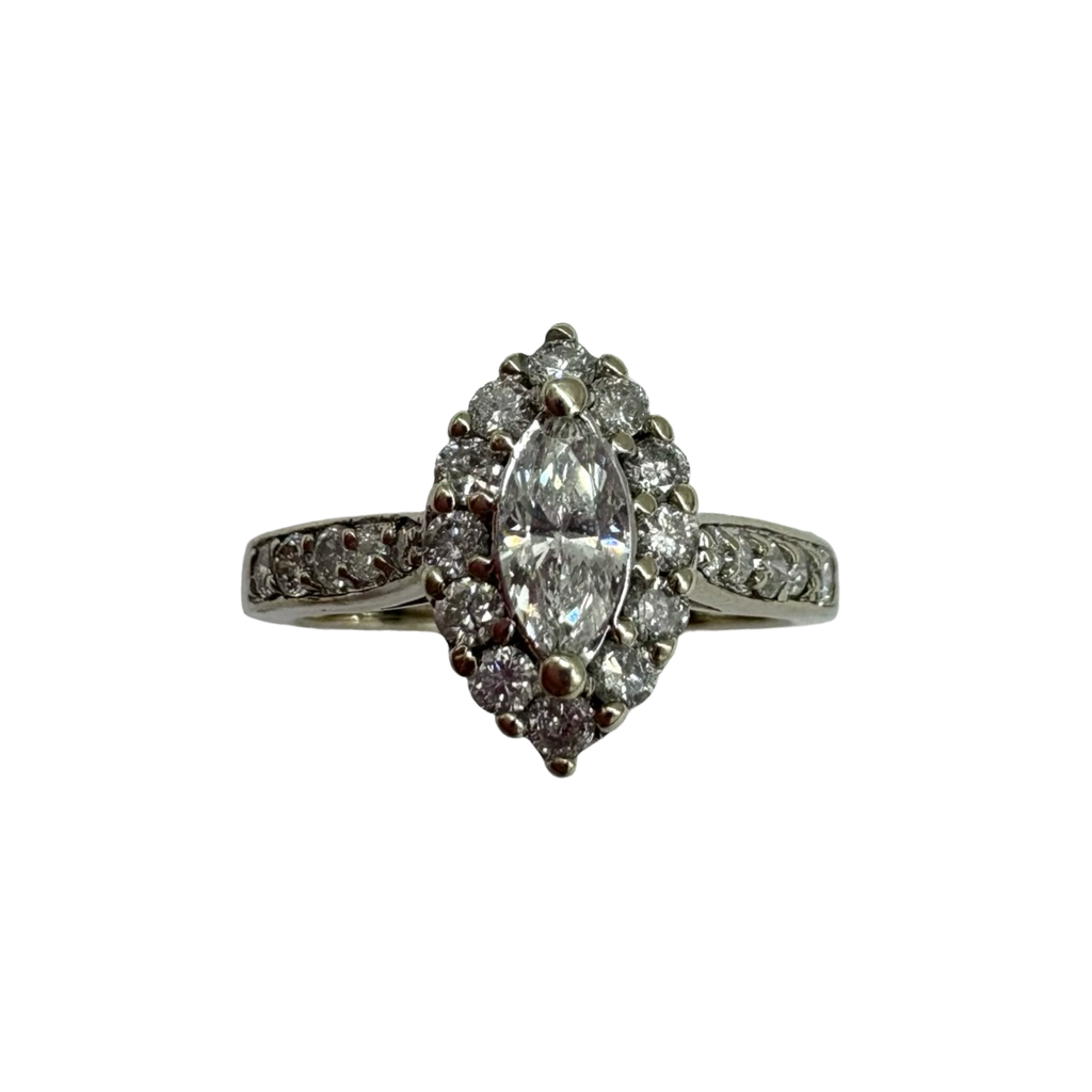 Diamond ring with marquise-shaped center stone on a white background