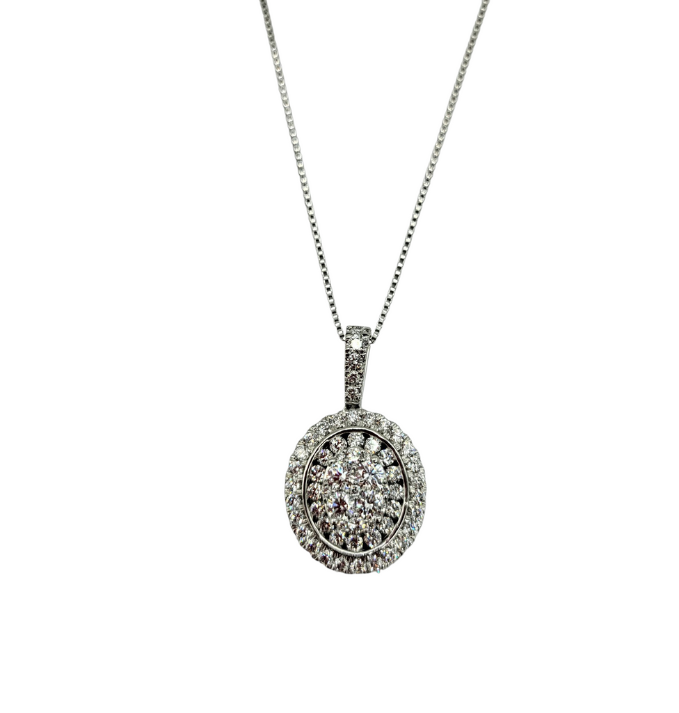 Silver necklace with a round pendant on a white background