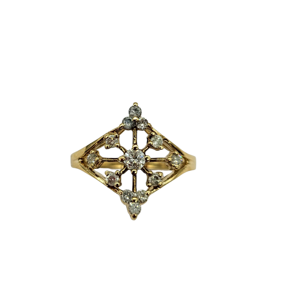 Gold ring with diamond-like stones on a white background