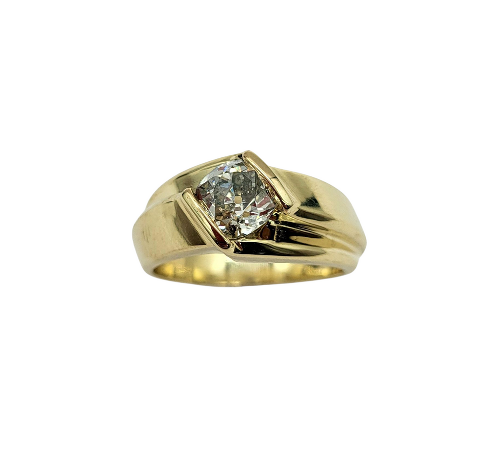 Gold ring with a diamond on a white background