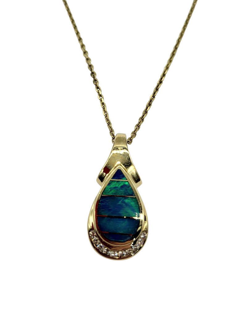 Gold necklace with a teardrop-shaped pendant featuring a blue stone on a white background