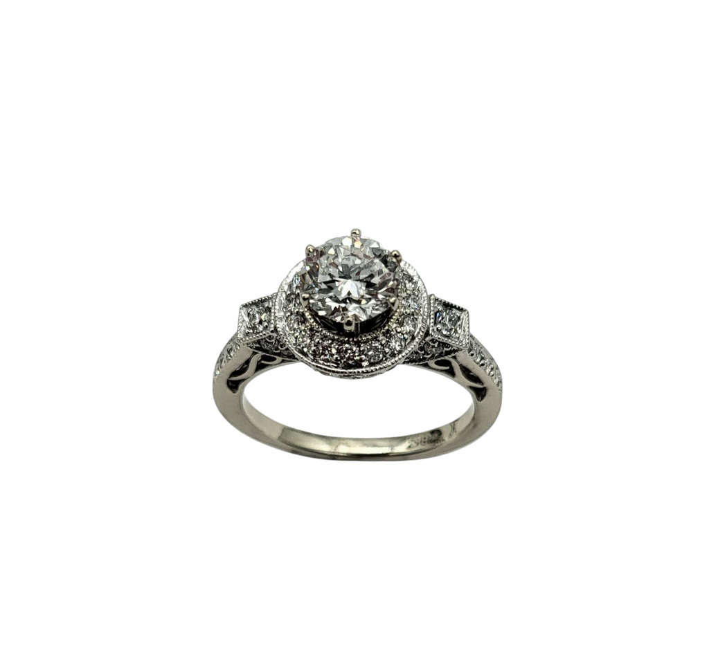 Diamond ring with intricate design on a white background