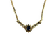 Gold necklace with a central black gemstone on a white background