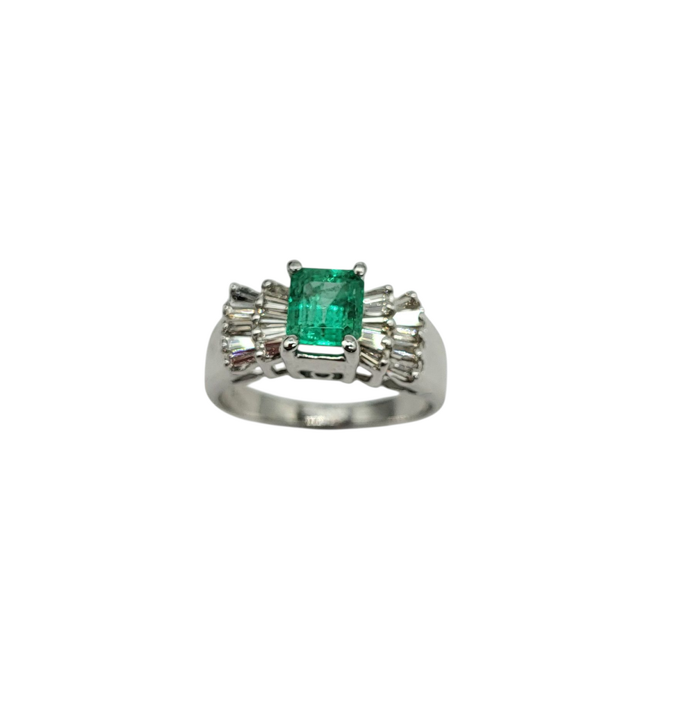 Silver ring with a green gemstone on a white background