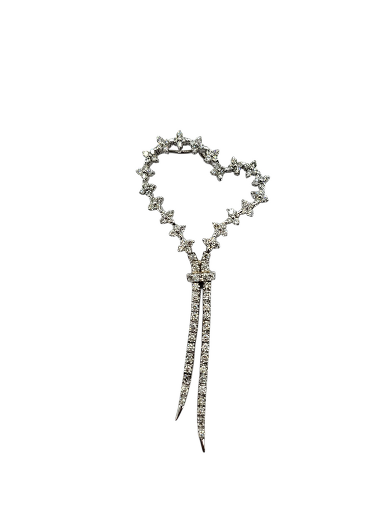 Decorative hairpin with heart-shaped top and pointed ends on a white background