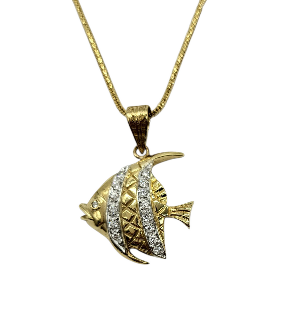 Gold fish-shaped pendant with diamond accents on a gold chain against a white background