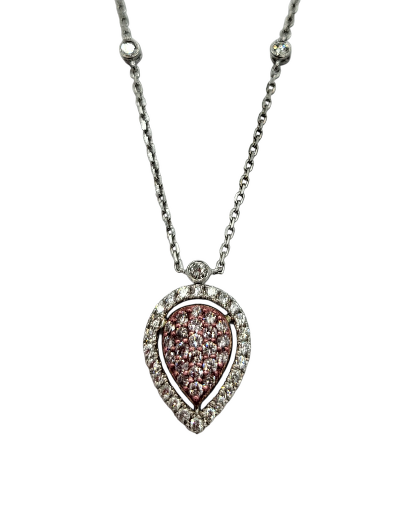 Teardrop-shaped diamond pendant on a chain against a white background