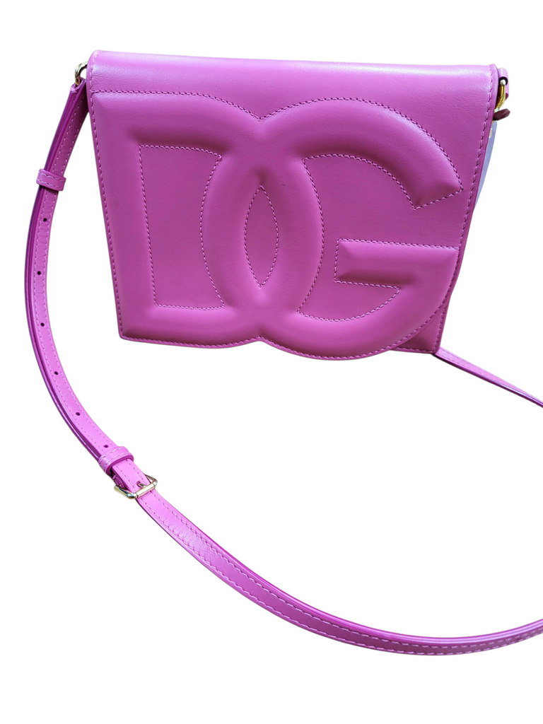 Pink handbag with a prominent logo on a white background
