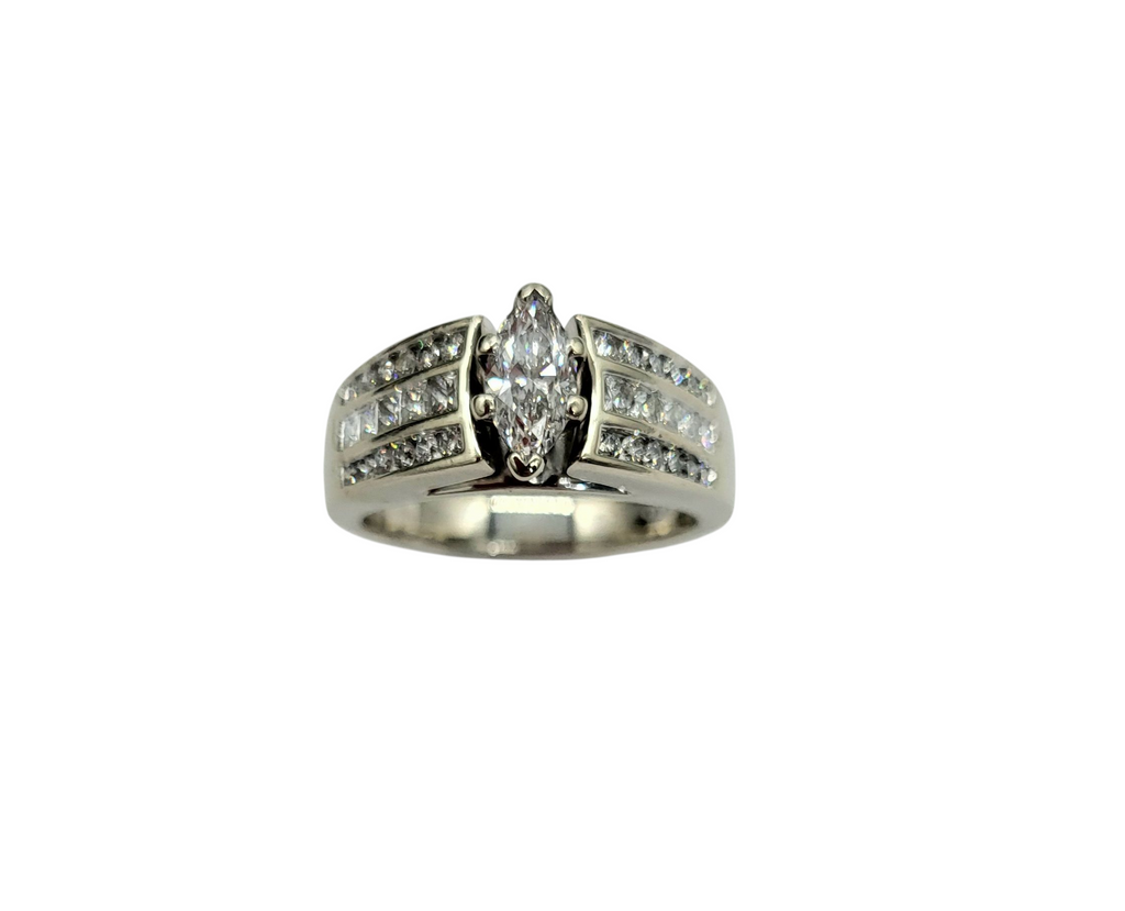 Silver ring with a central diamond and smaller diamonds on a white background