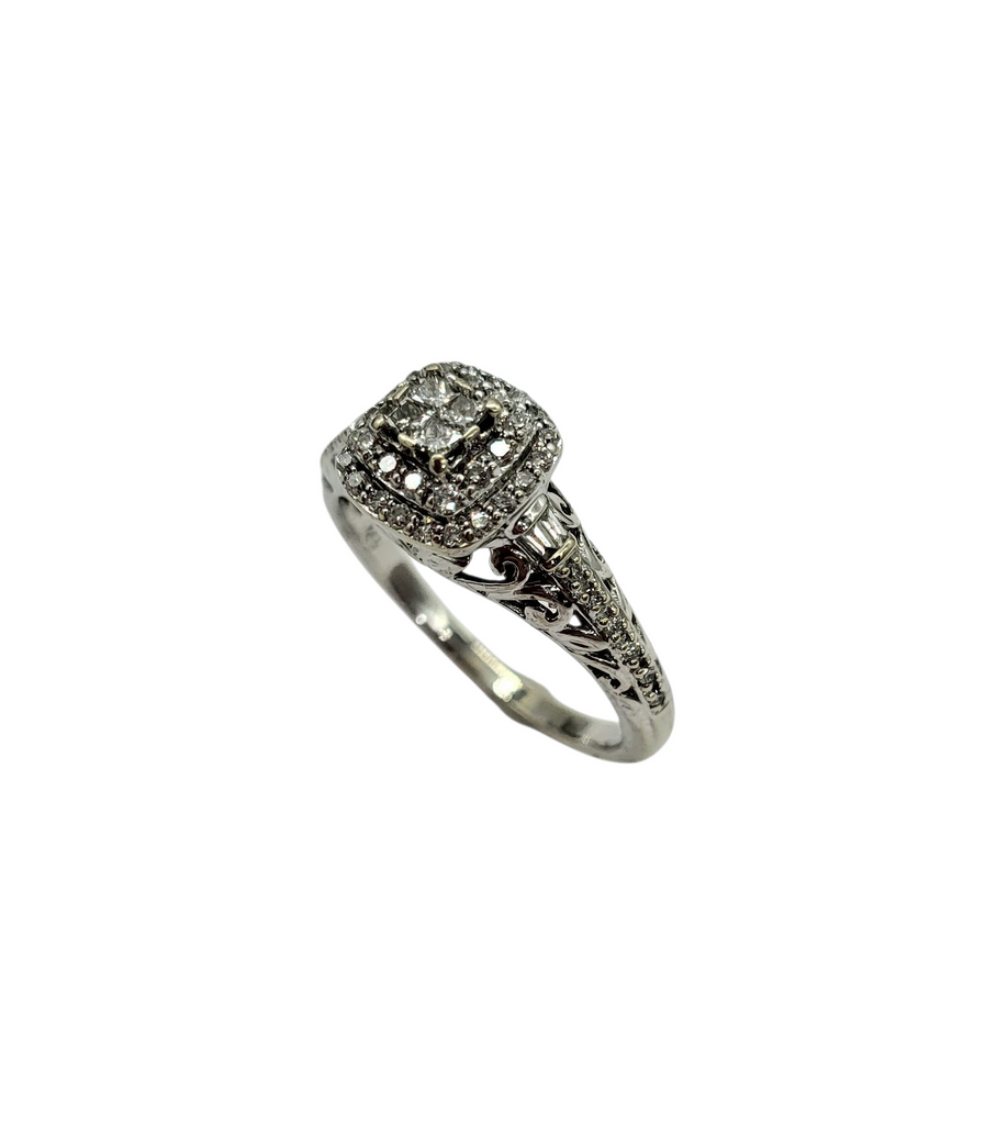 Silver ring with diamond accents on a white background