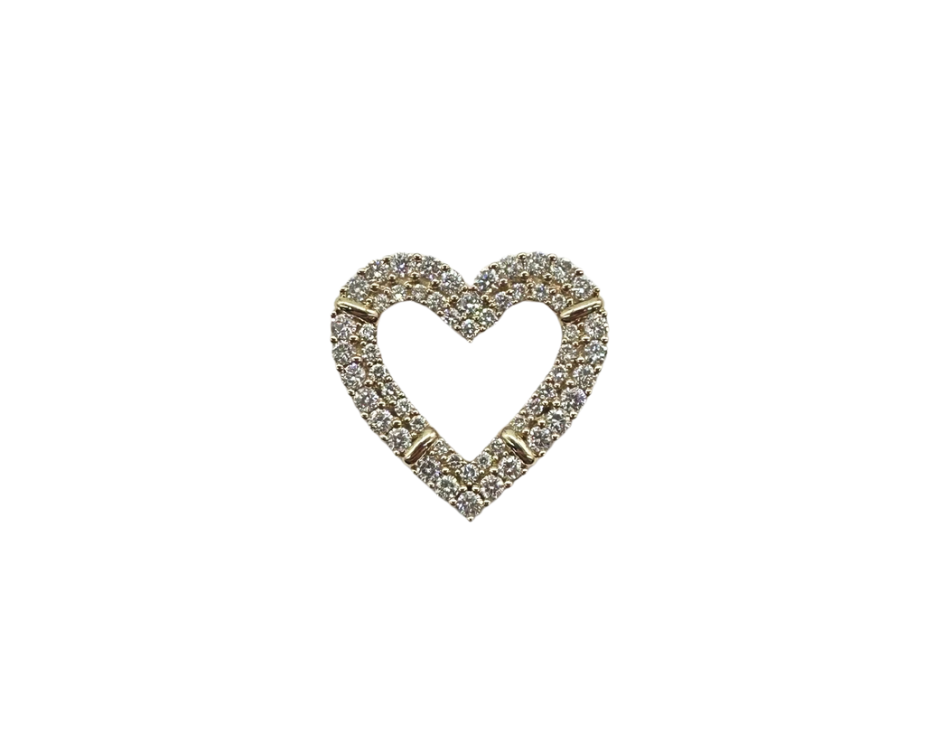 Heart-shaped brooch with gemstones on a white background