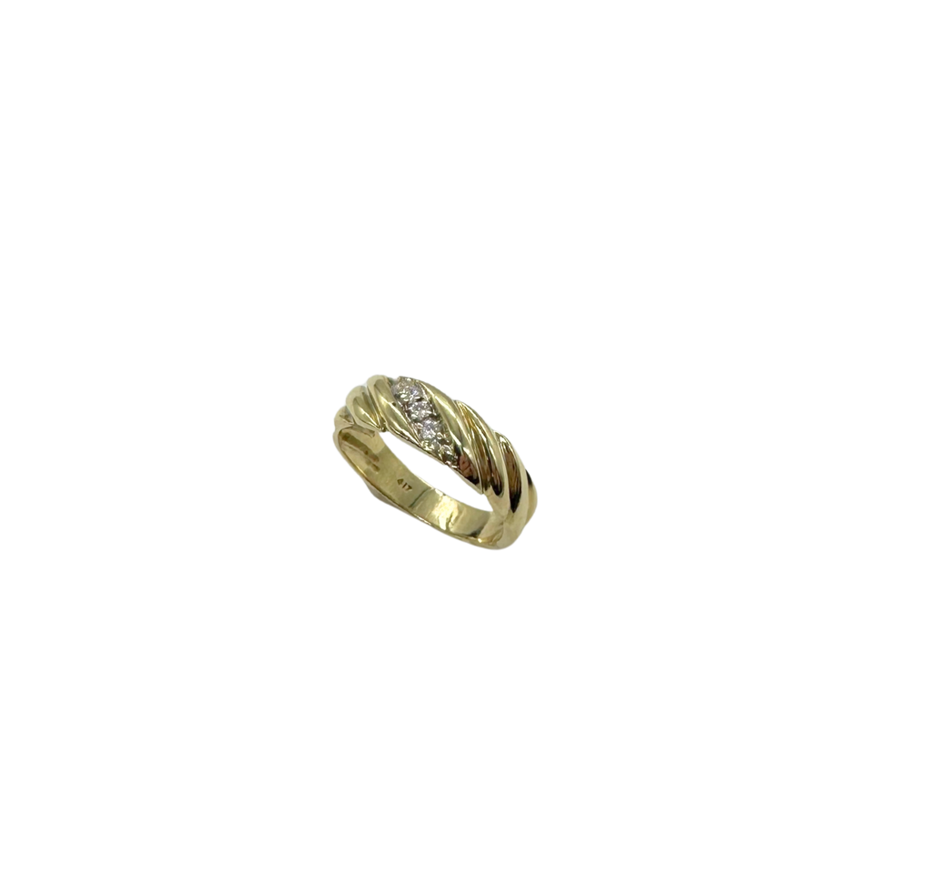 Gold ring with diamonds on a white background