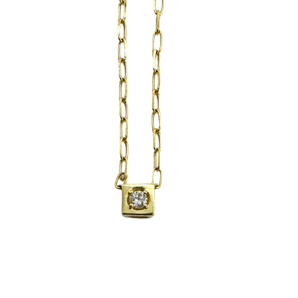 Gold necklace with a square pendant on a white background