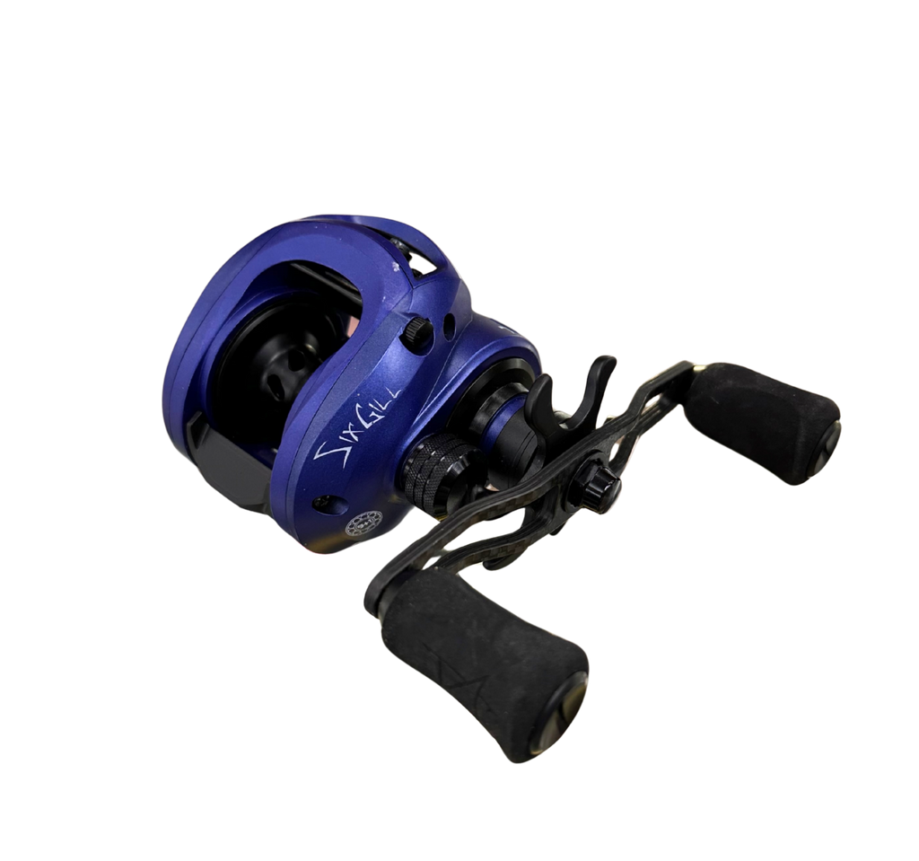 Blue and black fishing reel on a white background