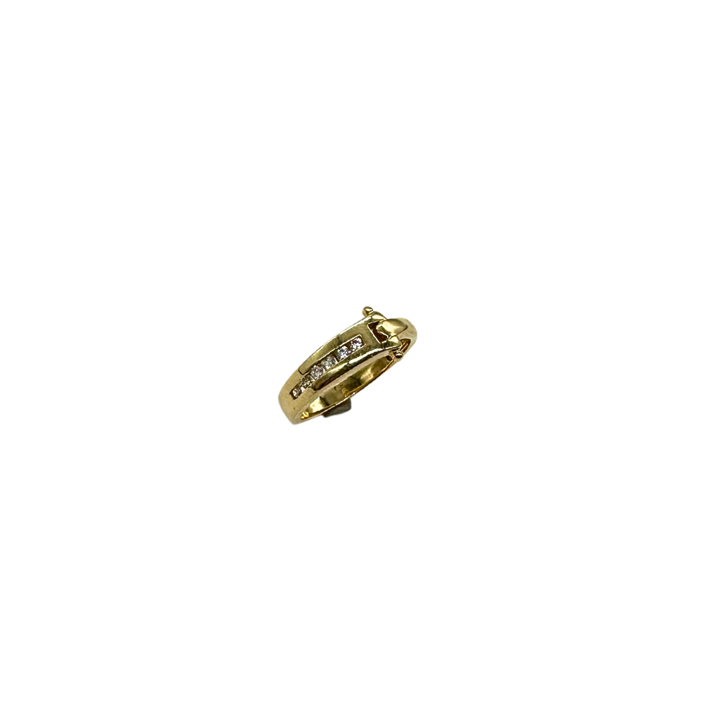 Gold ring with diamonds on a white background