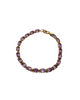 Bracelet with purple gemstones on a white background