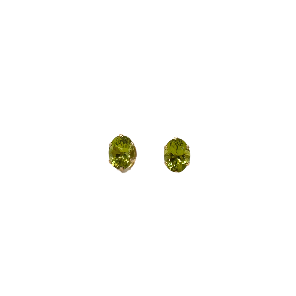 Pair of green gemstone stud earrings on a white background