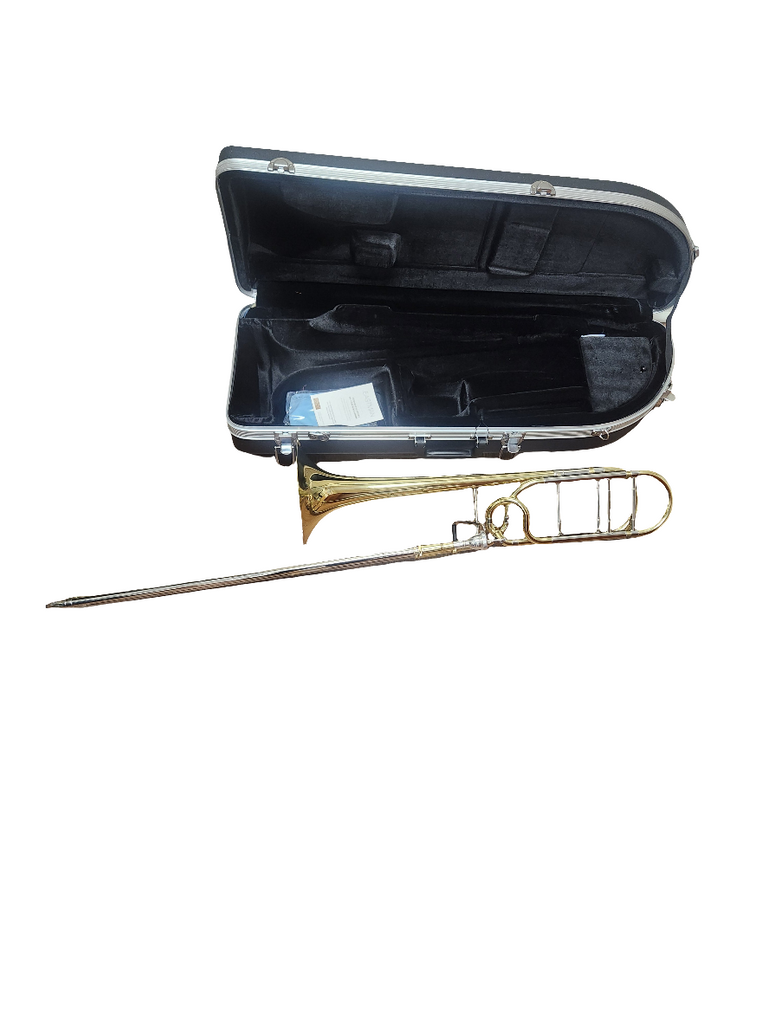 Gold trombone with case on a white background