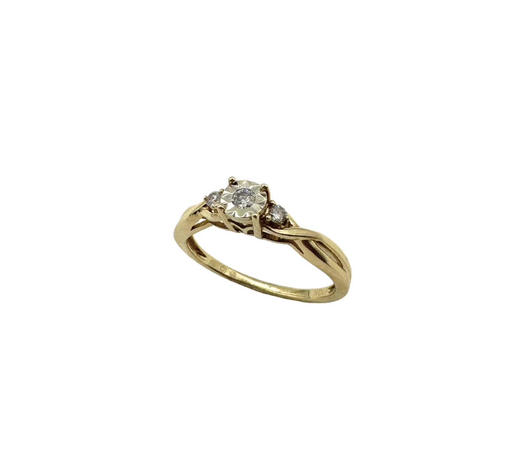 Gold ring with a diamond on a white background