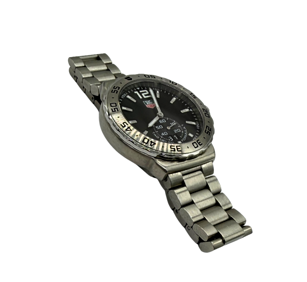 Silver watch with a black face on a white background