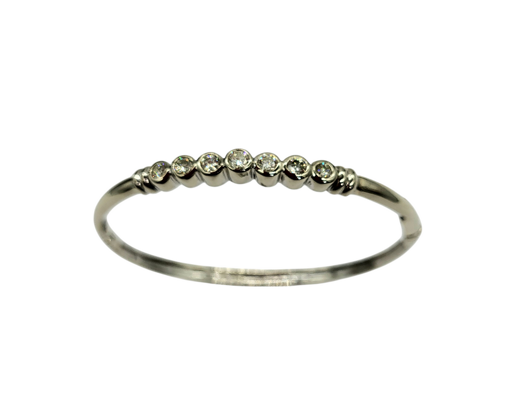 Silver ring with small diamonds on a white background