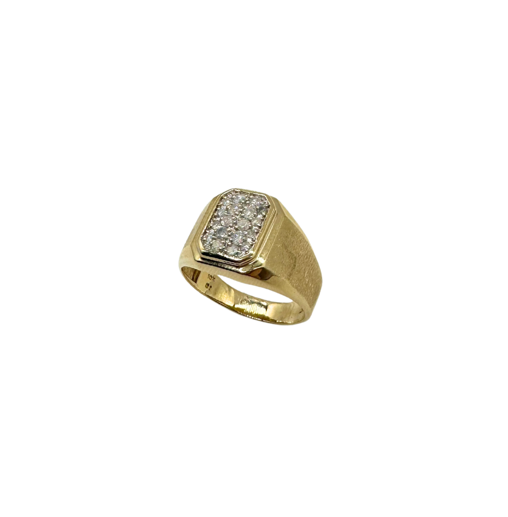 Gold ring with diamond-studded band on a white background