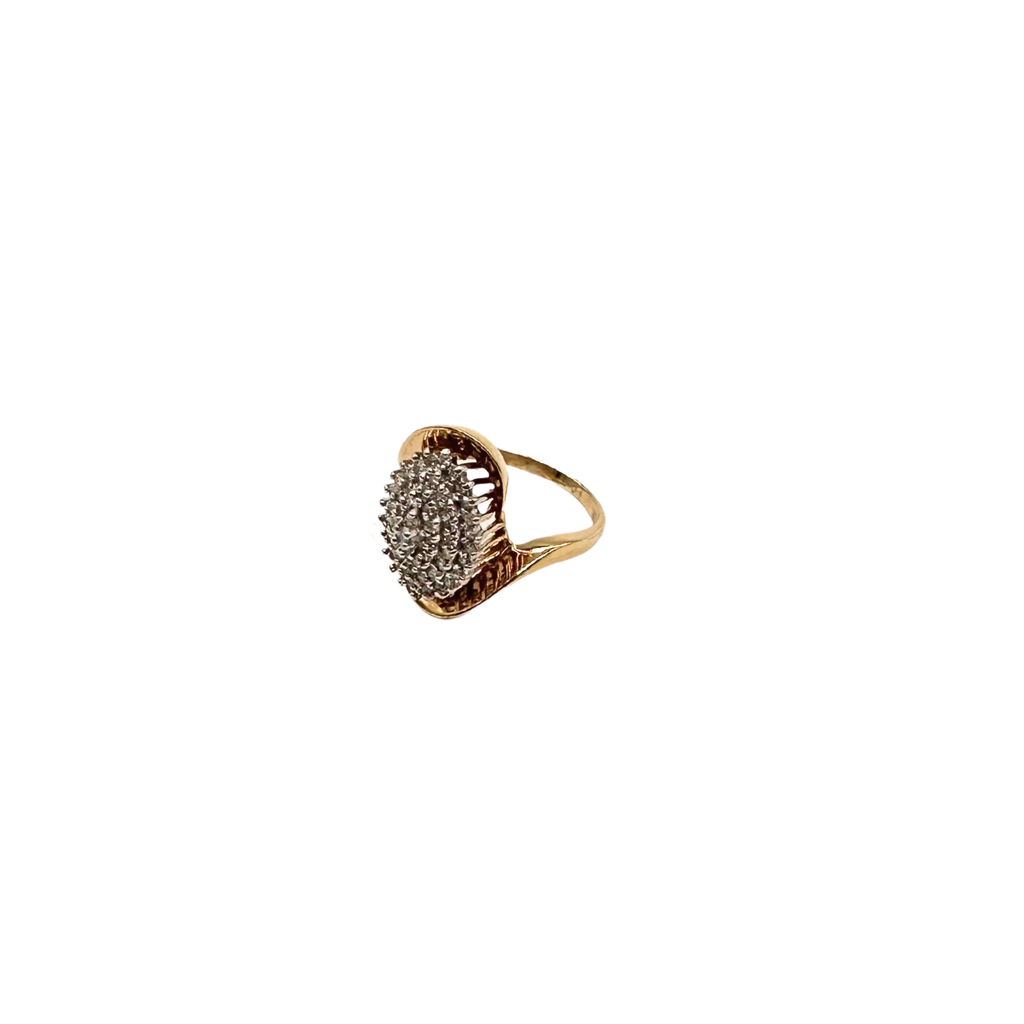 Gold ring with a heart-shaped diamond cluster on a white background