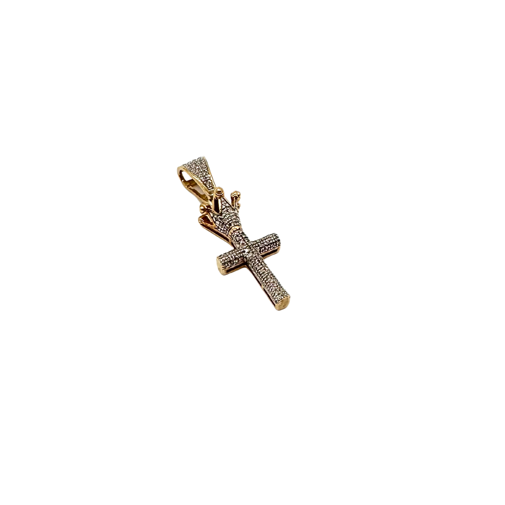 Gold cross pendant with diamonds on a white background