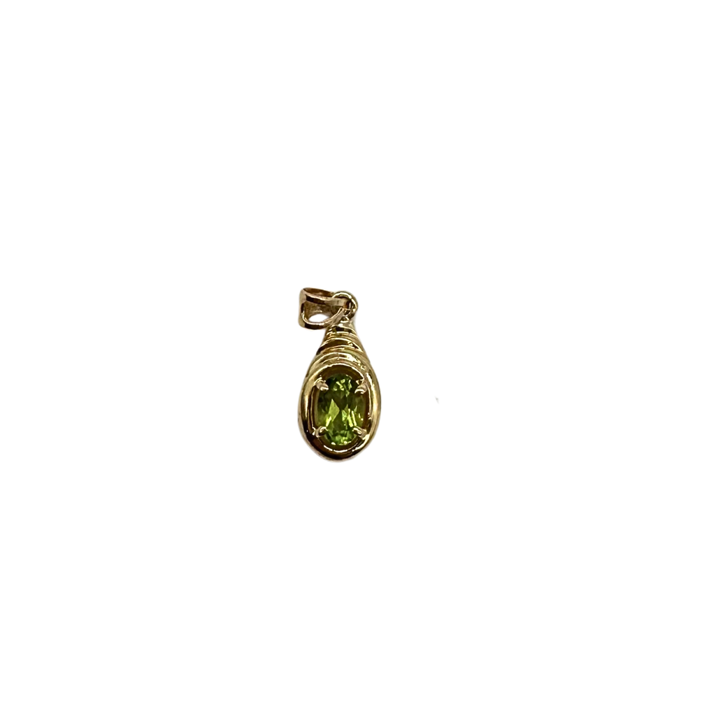 Gold pendant with a green gemstone on a white background
