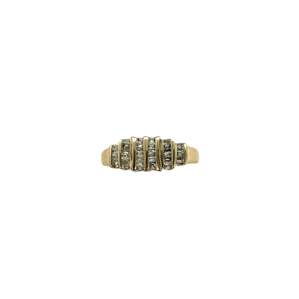 Gold ring with embedded stones on a white background