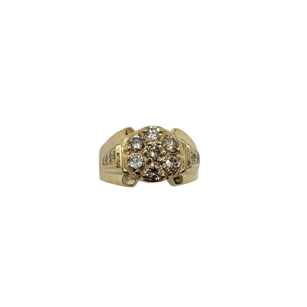 Gold ring with diamond cluster on a white background
