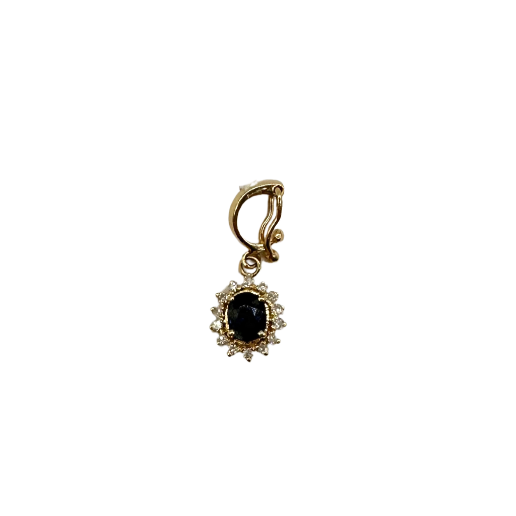 Gold earring with a black gemstone on a white background