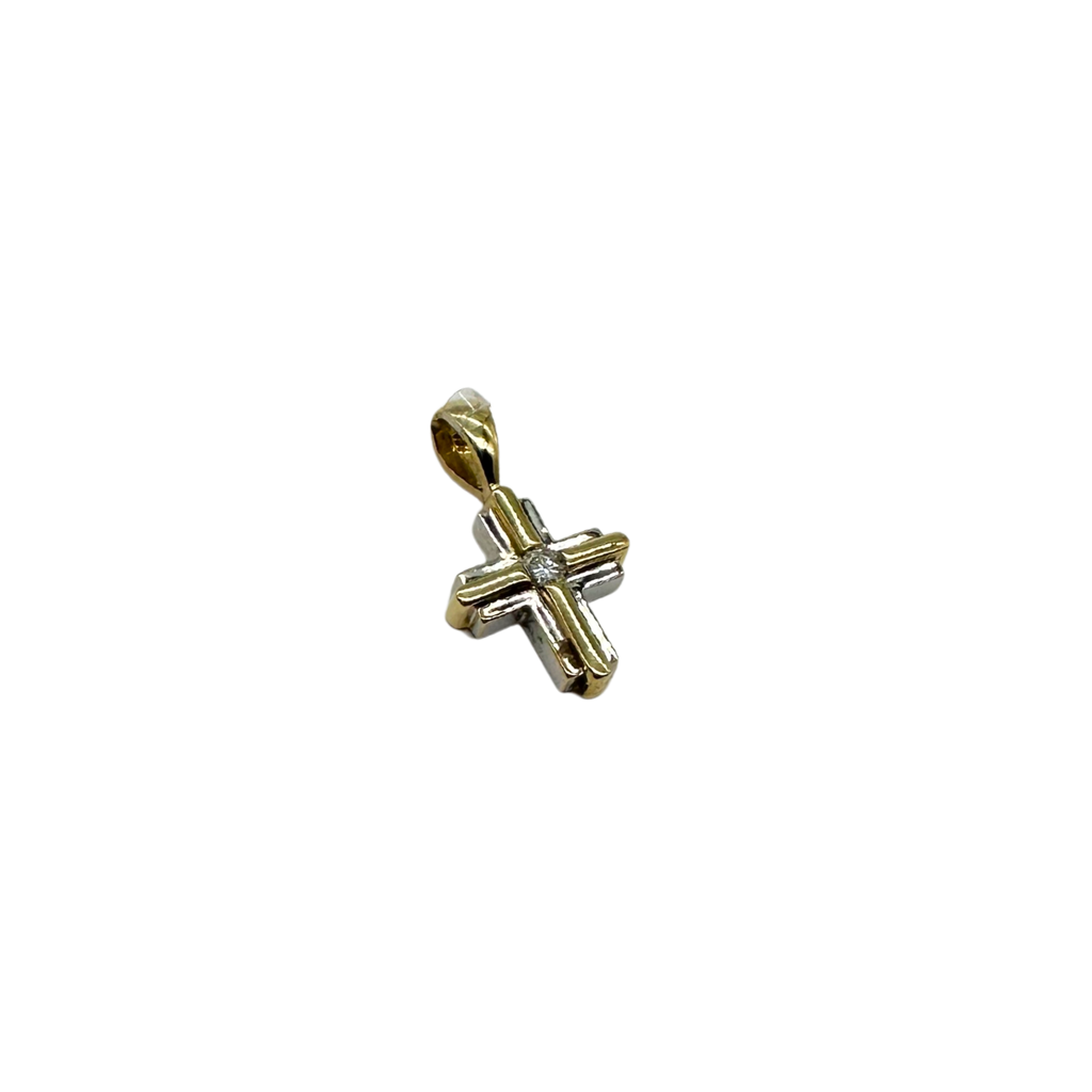 Gold cross pendant with a diamond on a white background