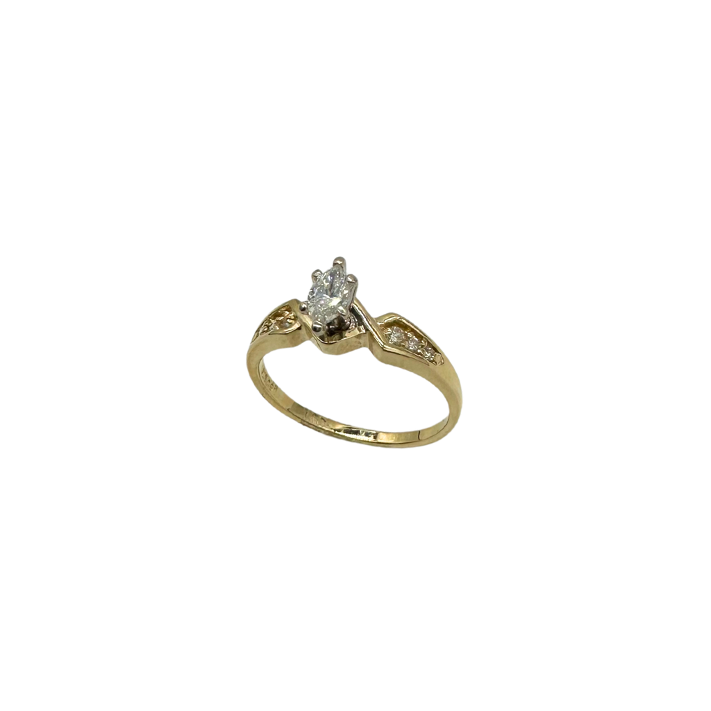 Gold ring with a diamond on a white background