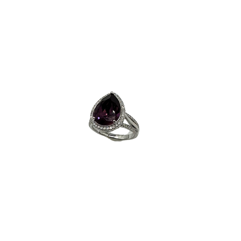 Silver ring with a purple gemstone on a white background