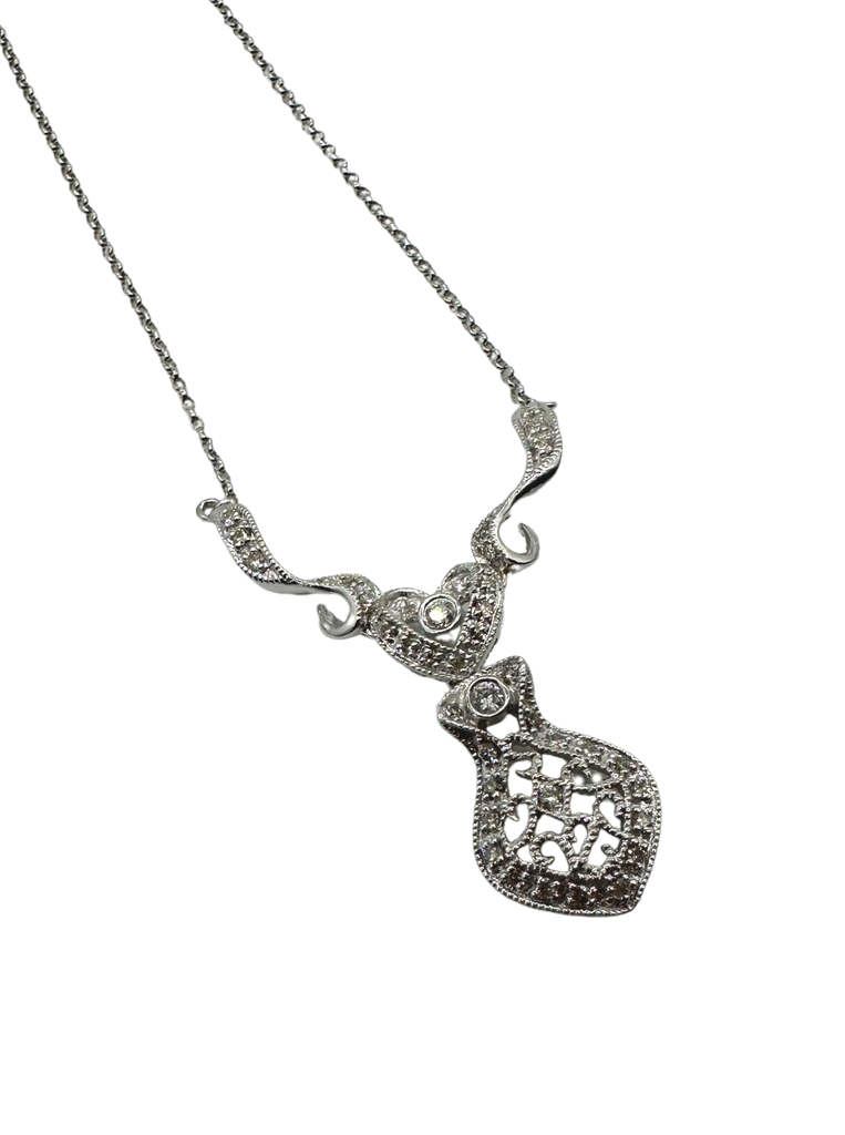 Silver necklace with a heart-shaped pendant on a white background