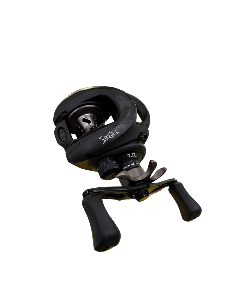 Black fishing reel on a white background