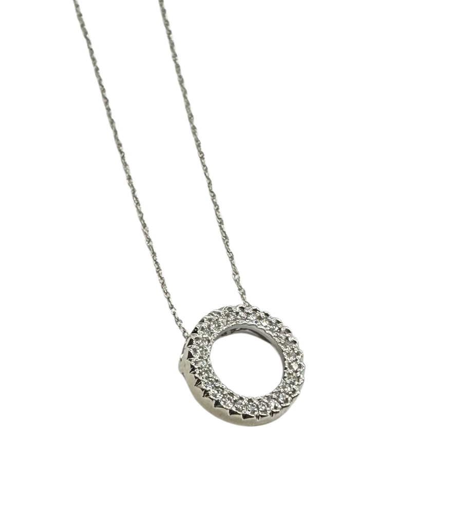 Silver necklace with a circular pendant on a white background