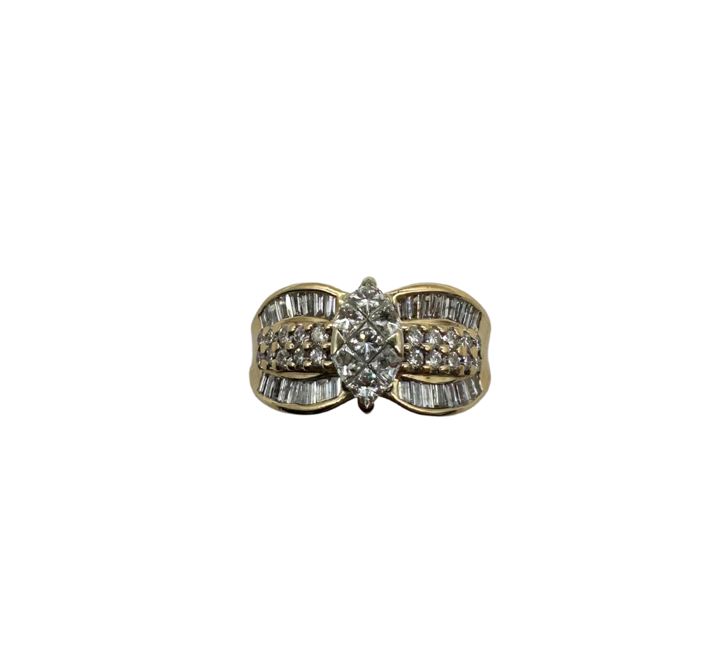 Gold and silver ring with a diamond on a white background