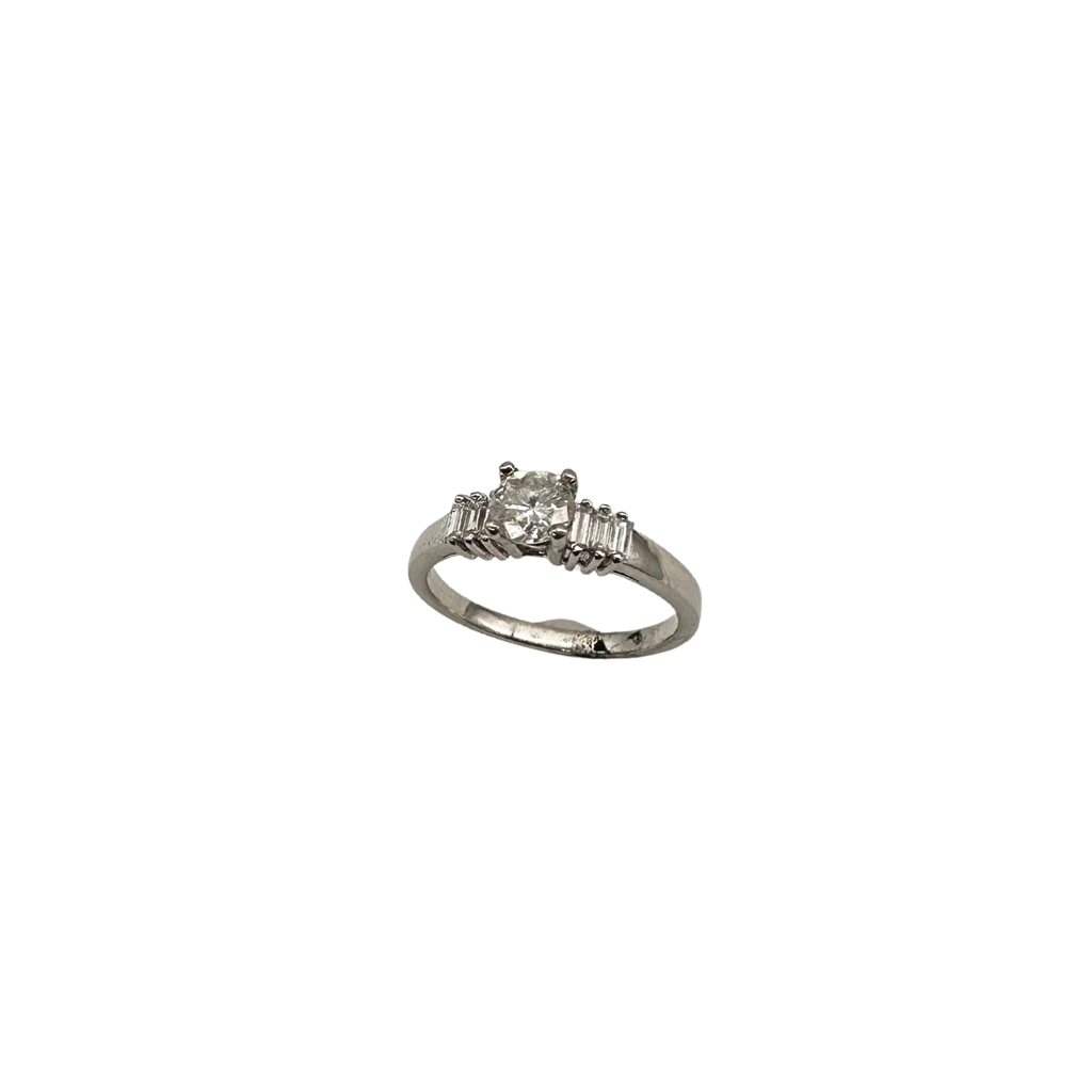 Silver ring with a diamond on a white background